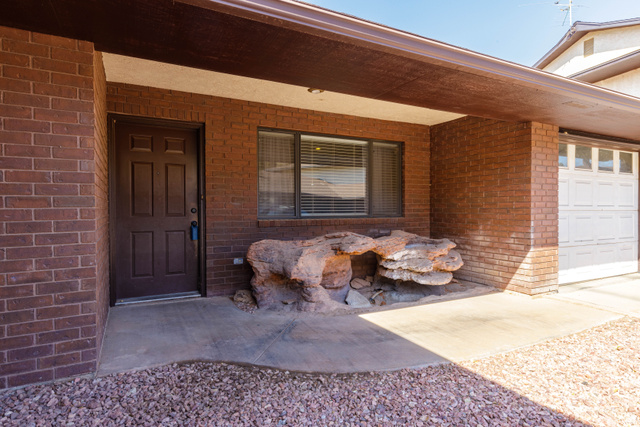 3707 Gates Circle Santa Clara, UT 84765 - Photo 4 of 19 Entrance to property with brick siding and a garage