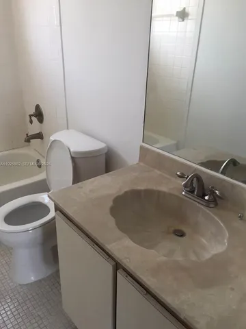 a bathroom with a sink and toilet