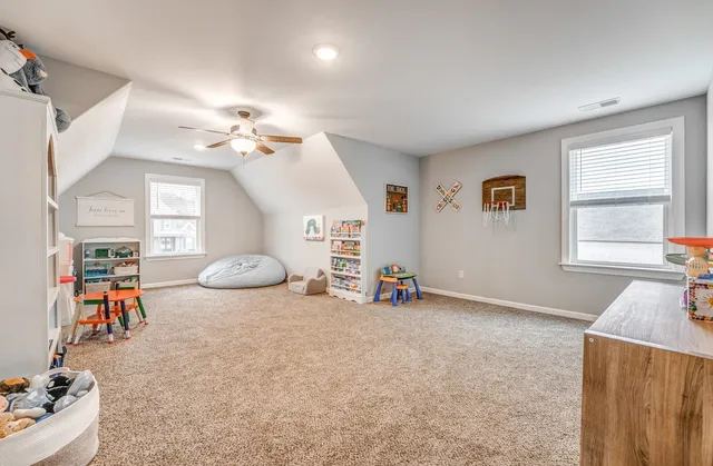a view of a livingroom with furniture and windows