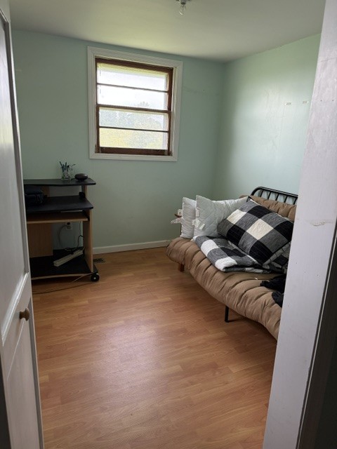 166 Indiana Avenue Ethridge, TN 38456 - Photo 14 of 18 a bed sitting in a room next to a window
