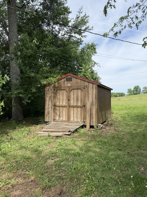 166 Indiana Avenue Ethridge, TN 38456 - Photo 18 of 18 a big yard with plants and large trees