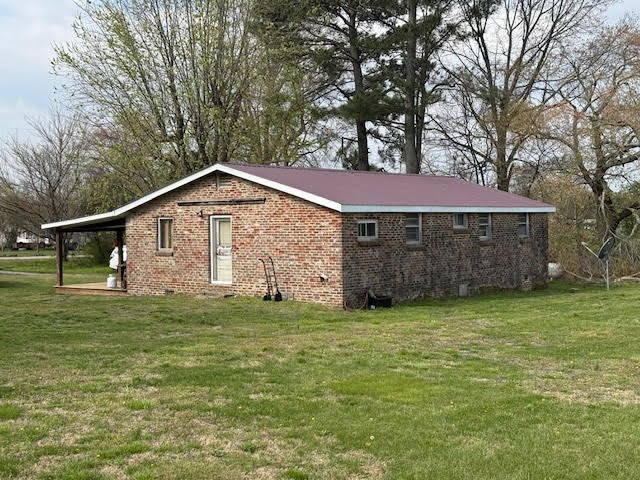 166 Indiana Avenue Ethridge, TN 38456 - Photo 3 of 18 a front view of a house with a yard