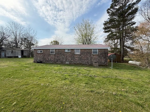 166 Indiana Avenue Ethridge, TN 38456 - Photo 4 of 18 a view of a house with a yard