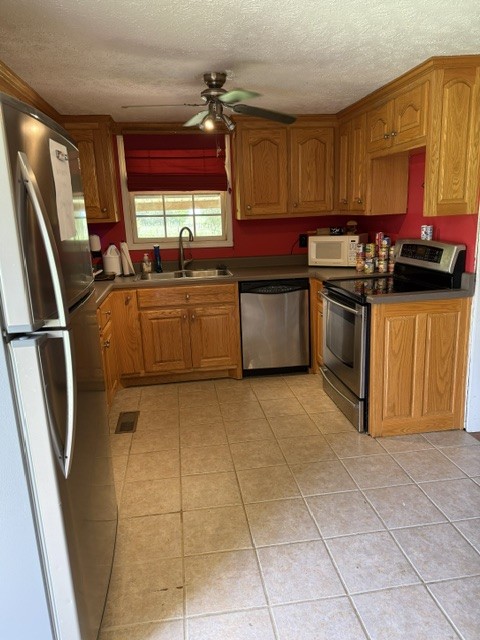 166 Indiana Avenue Ethridge, TN 38456 - Photo 9 of 18 a kitchen with stainless steel appliances granite countertop a stove a sink and a microwave