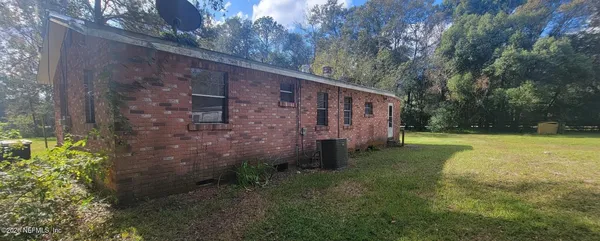a view of backyard with green space