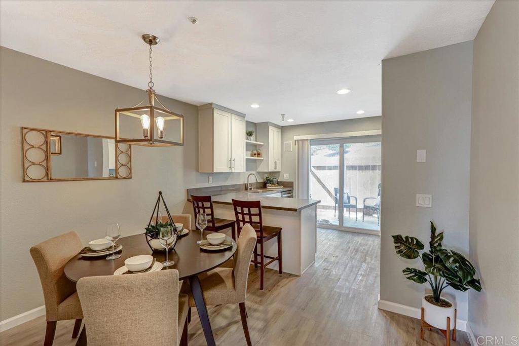 8186 Lemon Grove Way, Unit E Lemon Grove, CA 91945 - Photo 5 of 20 a view of a dining room with furniture window and wooden floor