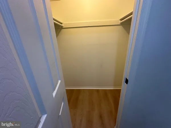 an empty room with wooden floor