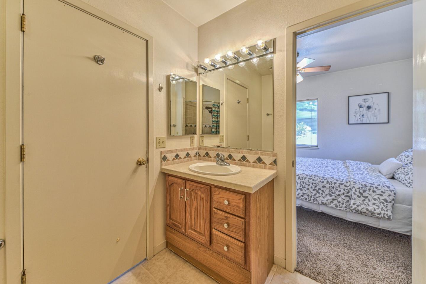 394 Mesa Road Salinas, CA 93908 - Photo 46 of 53 a bathroom with a sink double vanity and a shower