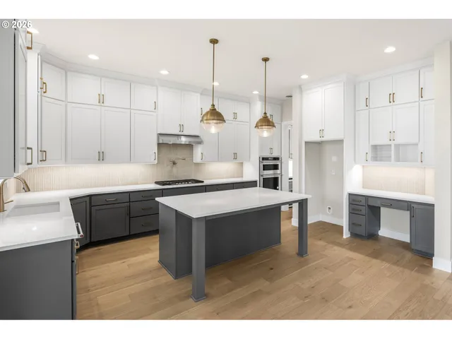 a large kitchen with a lot of counter space and a sink