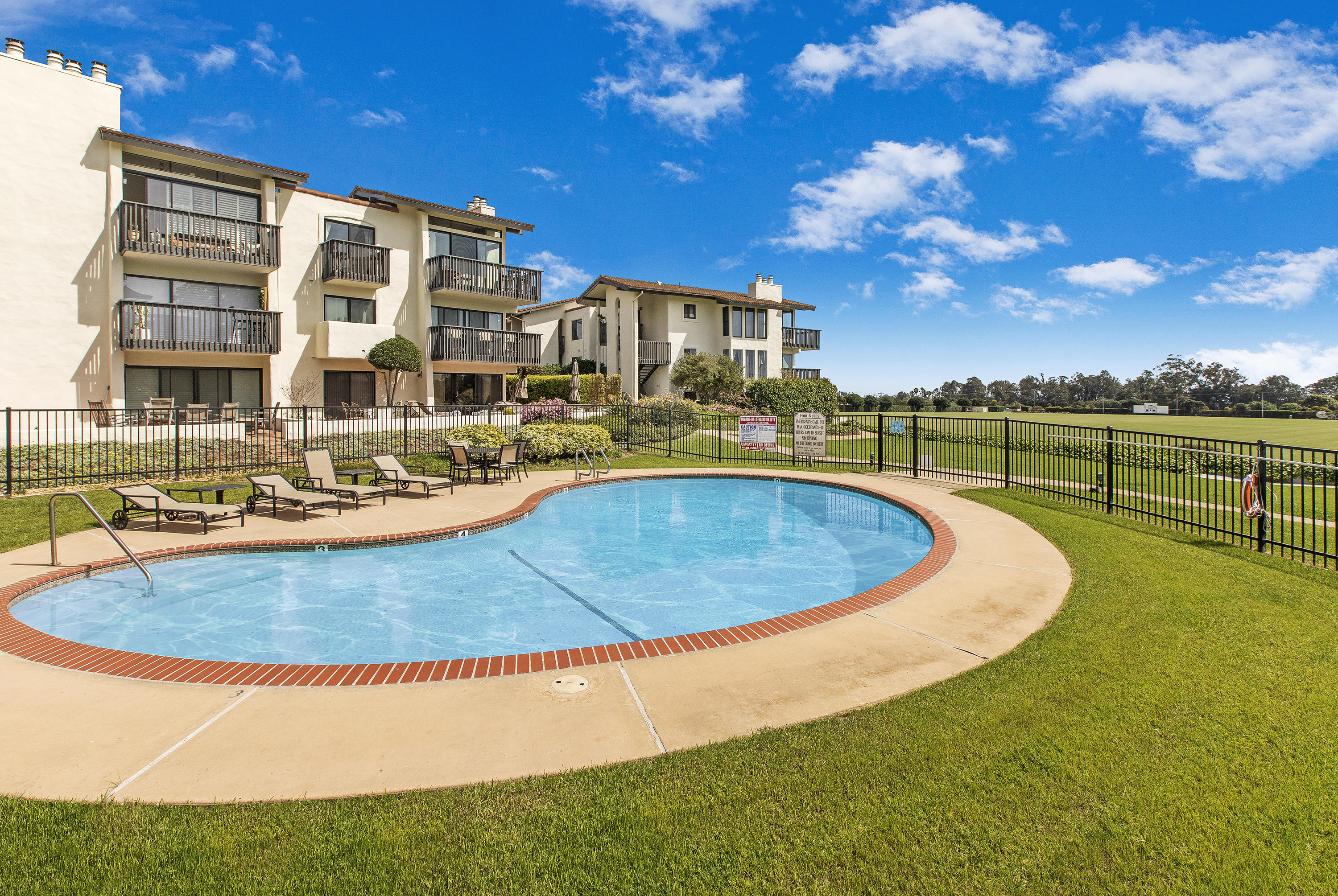 3375 Foothill Road, Unit 1012 Carpinteria, CA 93013 - Photo 14 of 15 a view of a swimming pool with outdoor seating