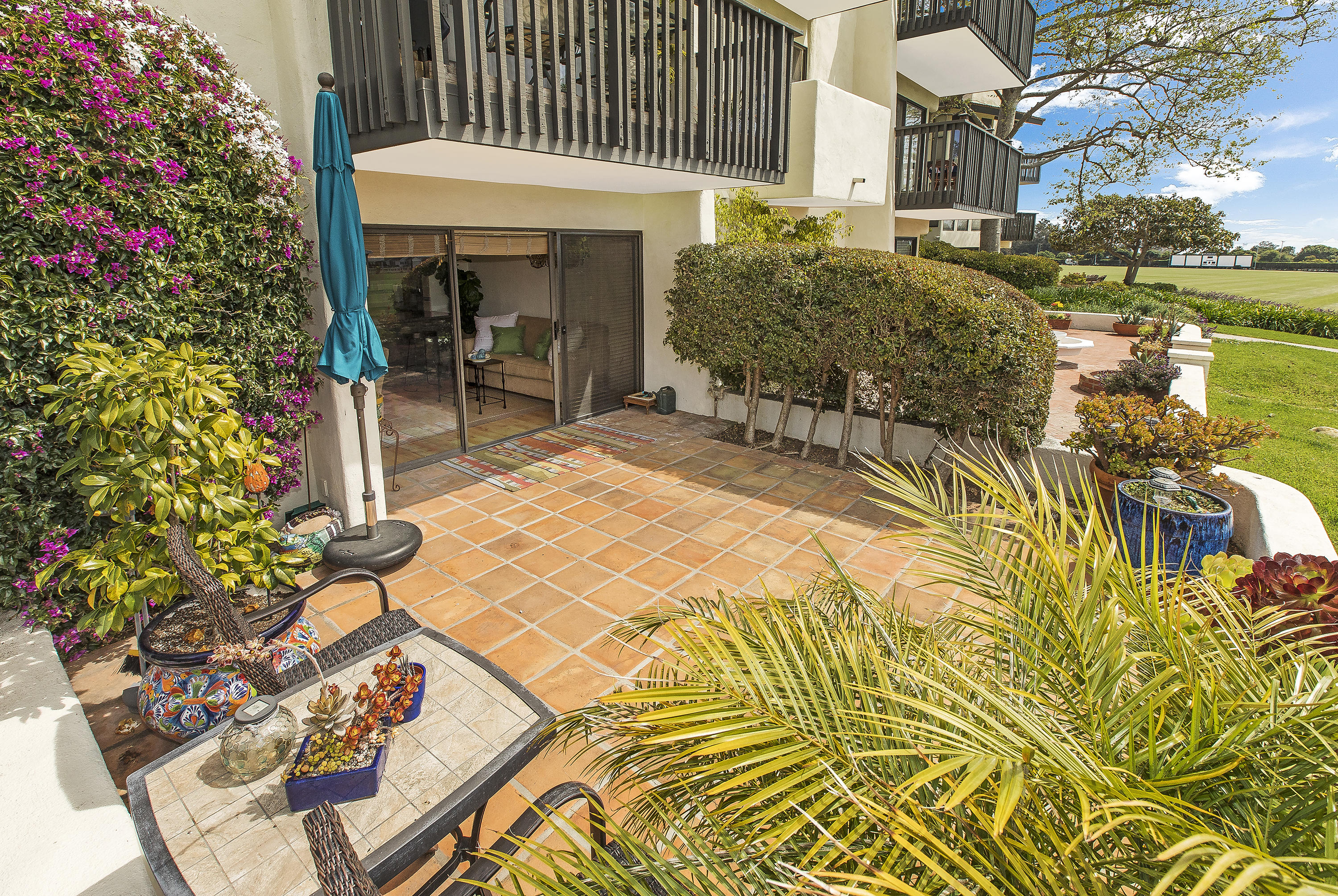 3375 Foothill Road, Unit 1012 Carpinteria, CA 93013 - Photo 9 of 15 a view of a patio with table and chairs and potted plants