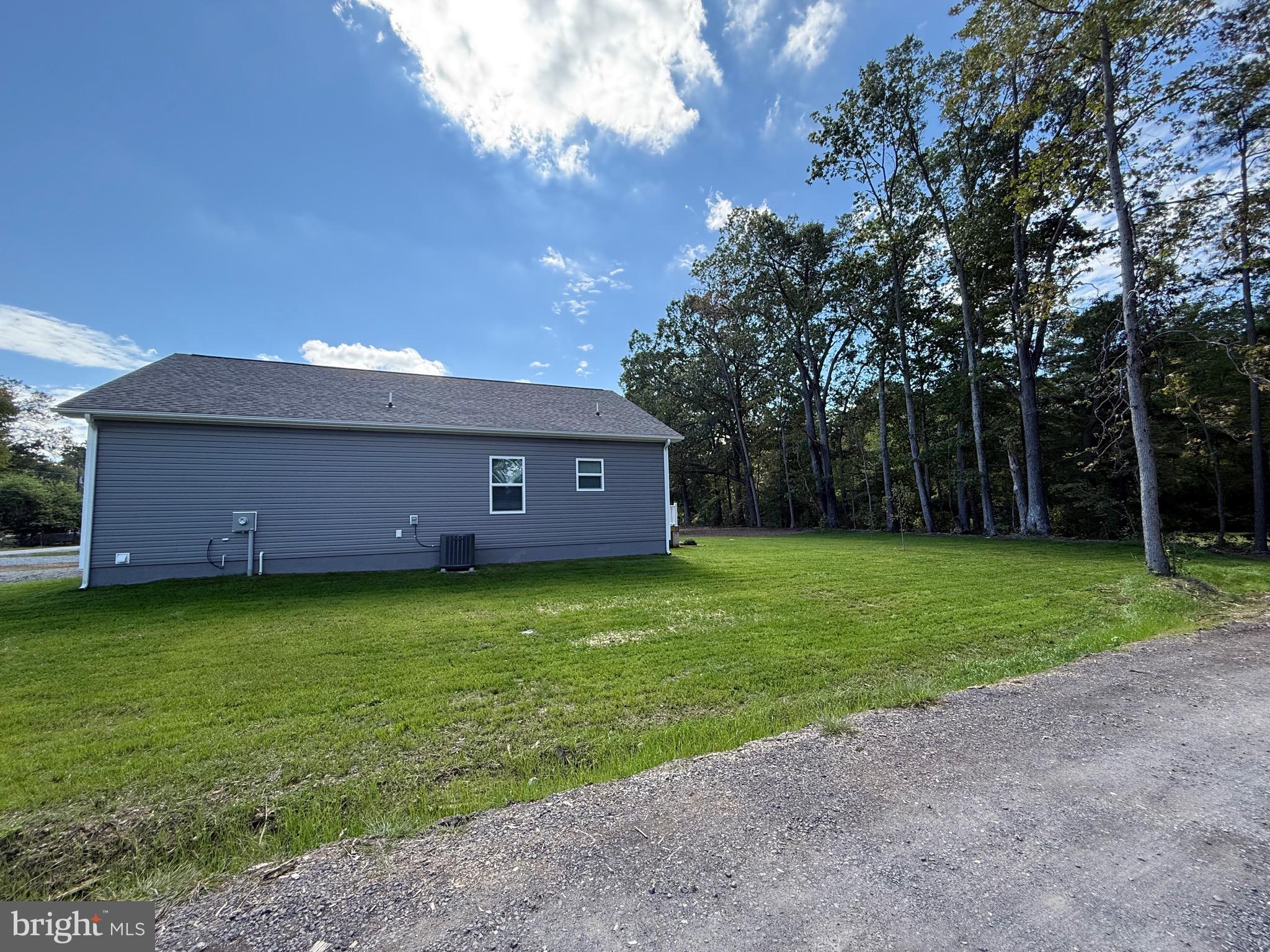 219 Holly Way Colonial Beach, VA 22443 - Photo 3 of 68 a front view of a house with garden