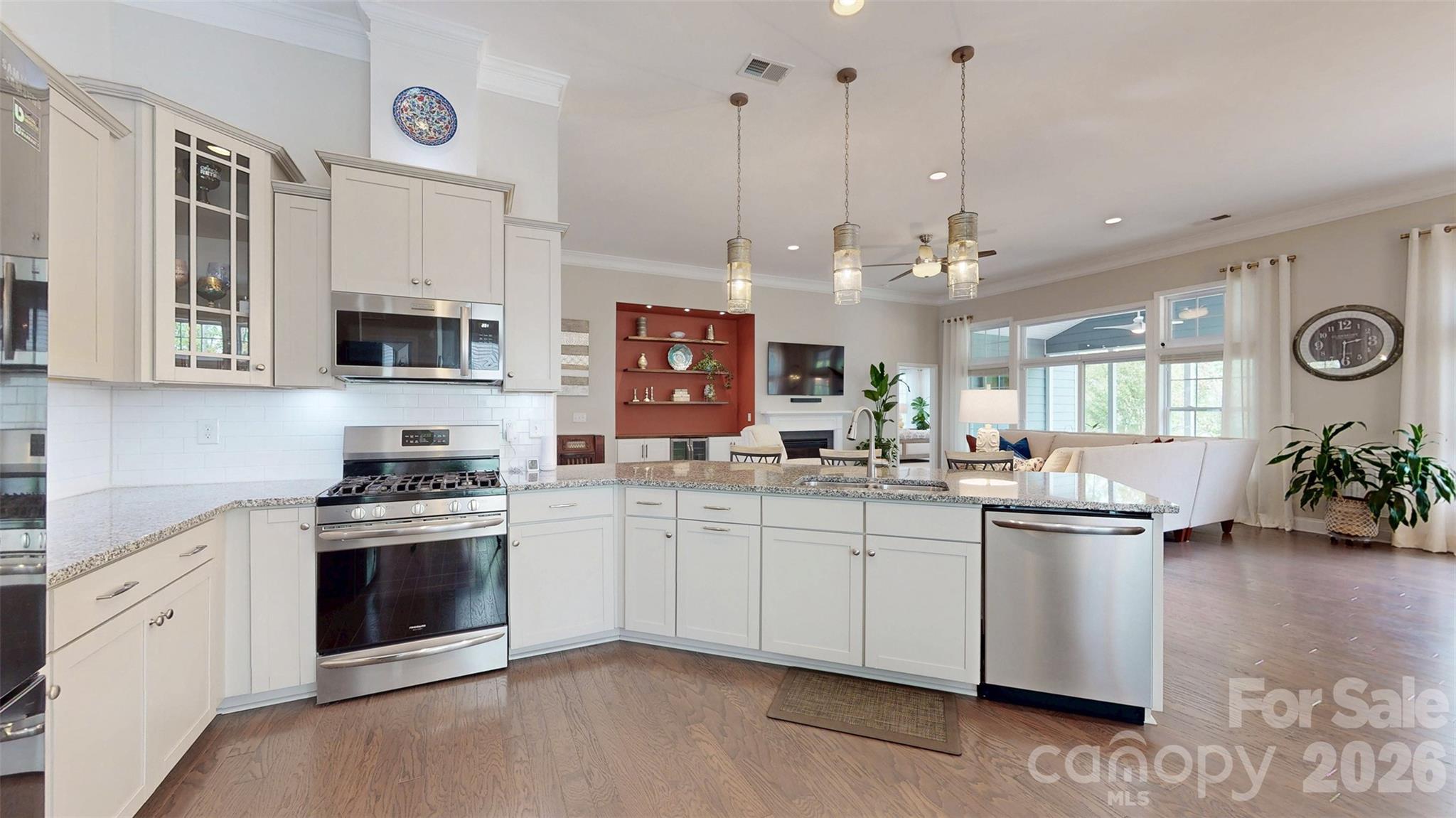 3036 Bridgewater Street Lancaster, SC 29720 - Photo 14 of 41 a kitchen with stainless steel appliances granite countertop a stove and cabinets