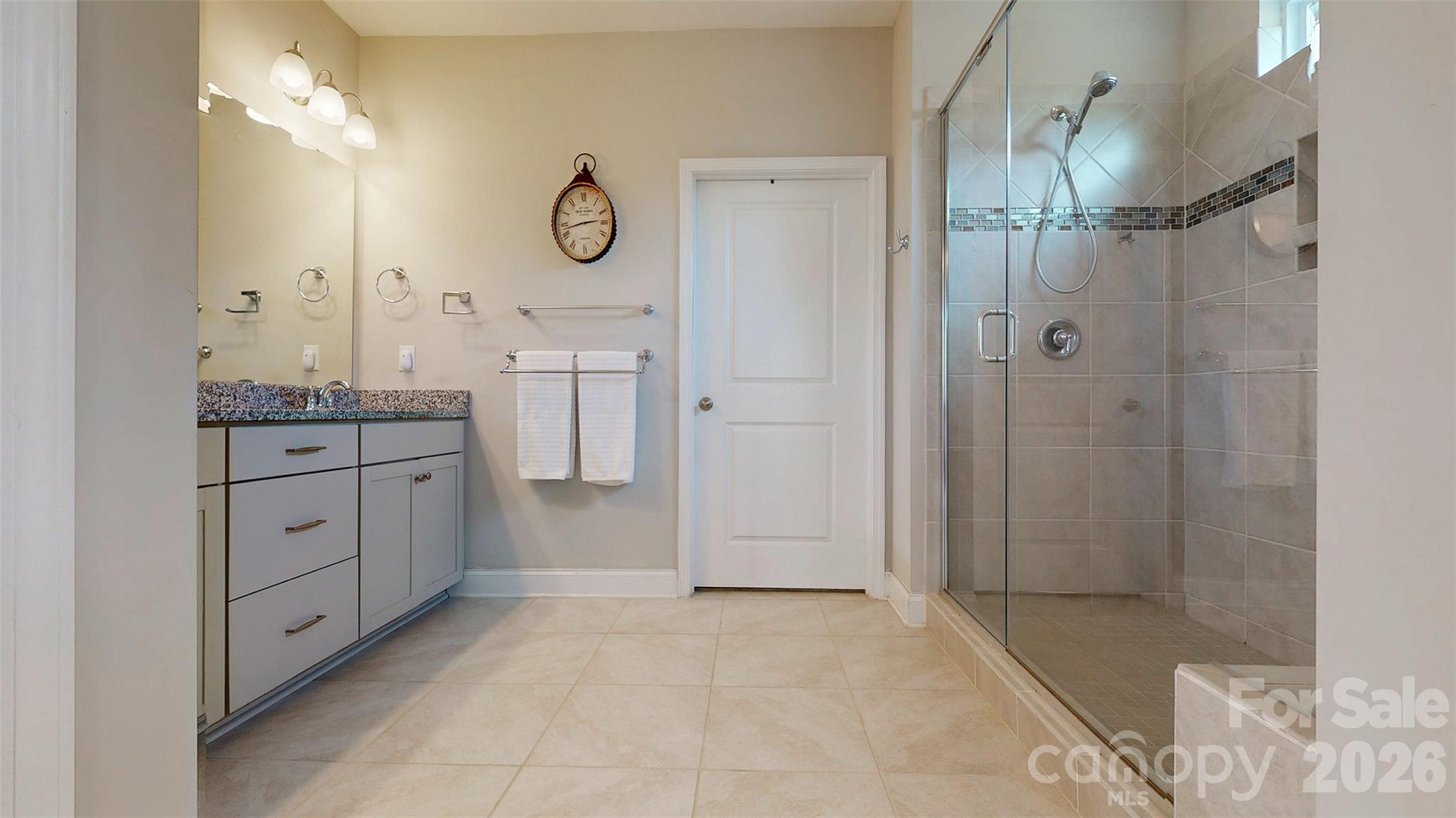 3036 Bridgewater Street Lancaster, SC 29720 - Photo 19 of 41 a spacious bathroom with a granite countertop sink mirror and shower