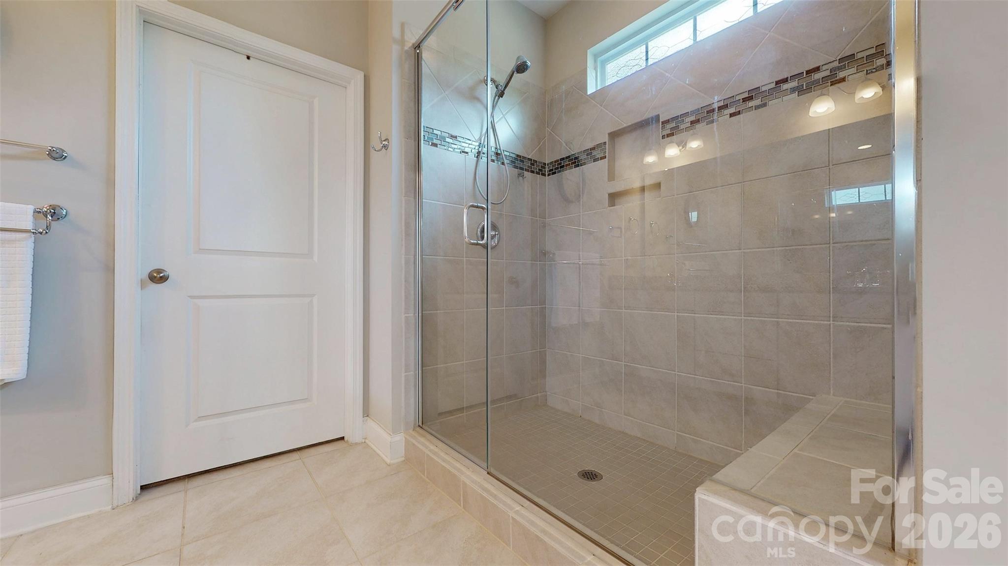 3036 Bridgewater Street Lancaster, SC 29720 - Photo 20 of 41 a bathroom with a glass shower door