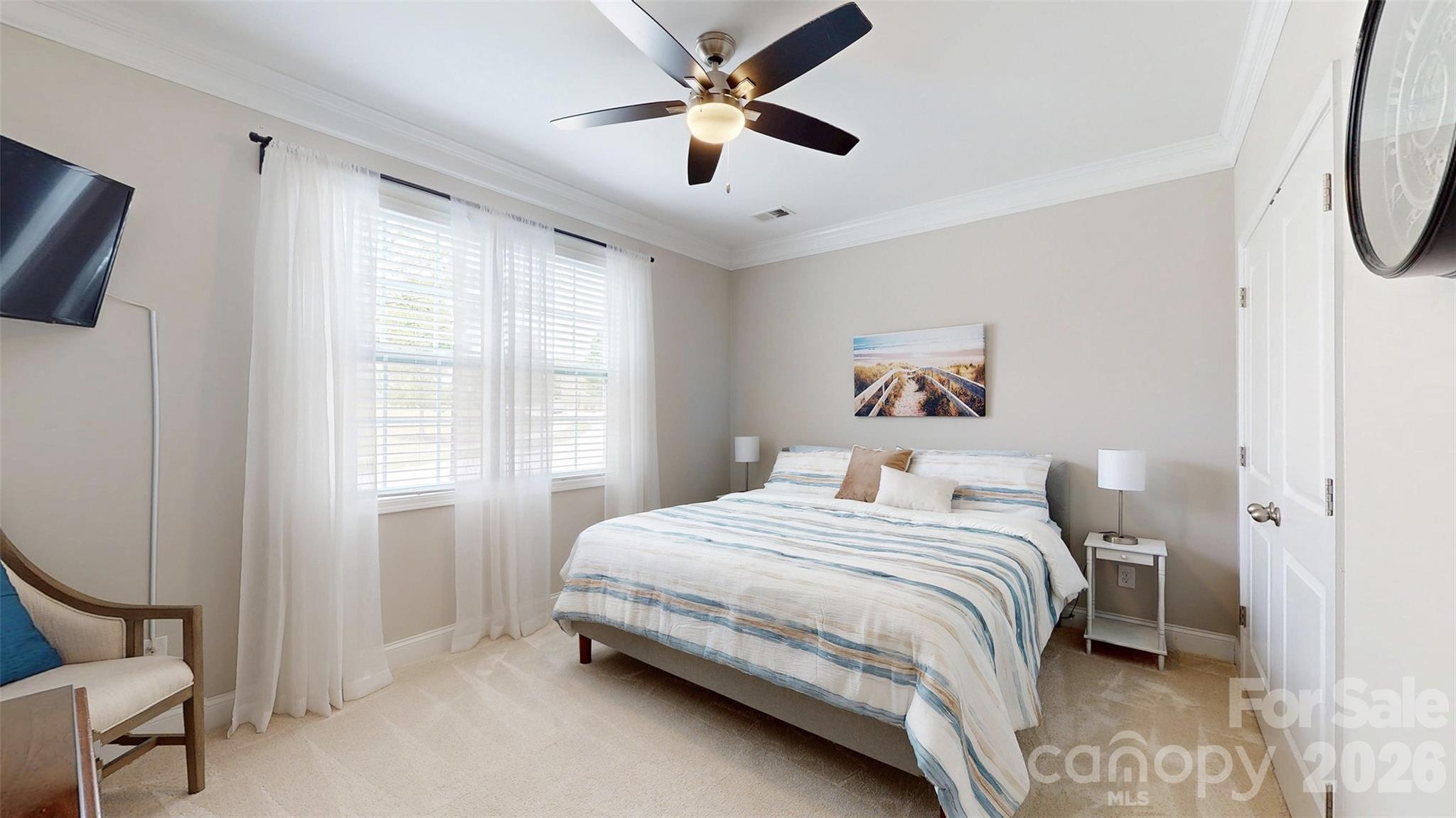 3036 Bridgewater Street Lancaster, SC 29720 - Photo 22 of 41 a bedroom with a bed and a chandelier