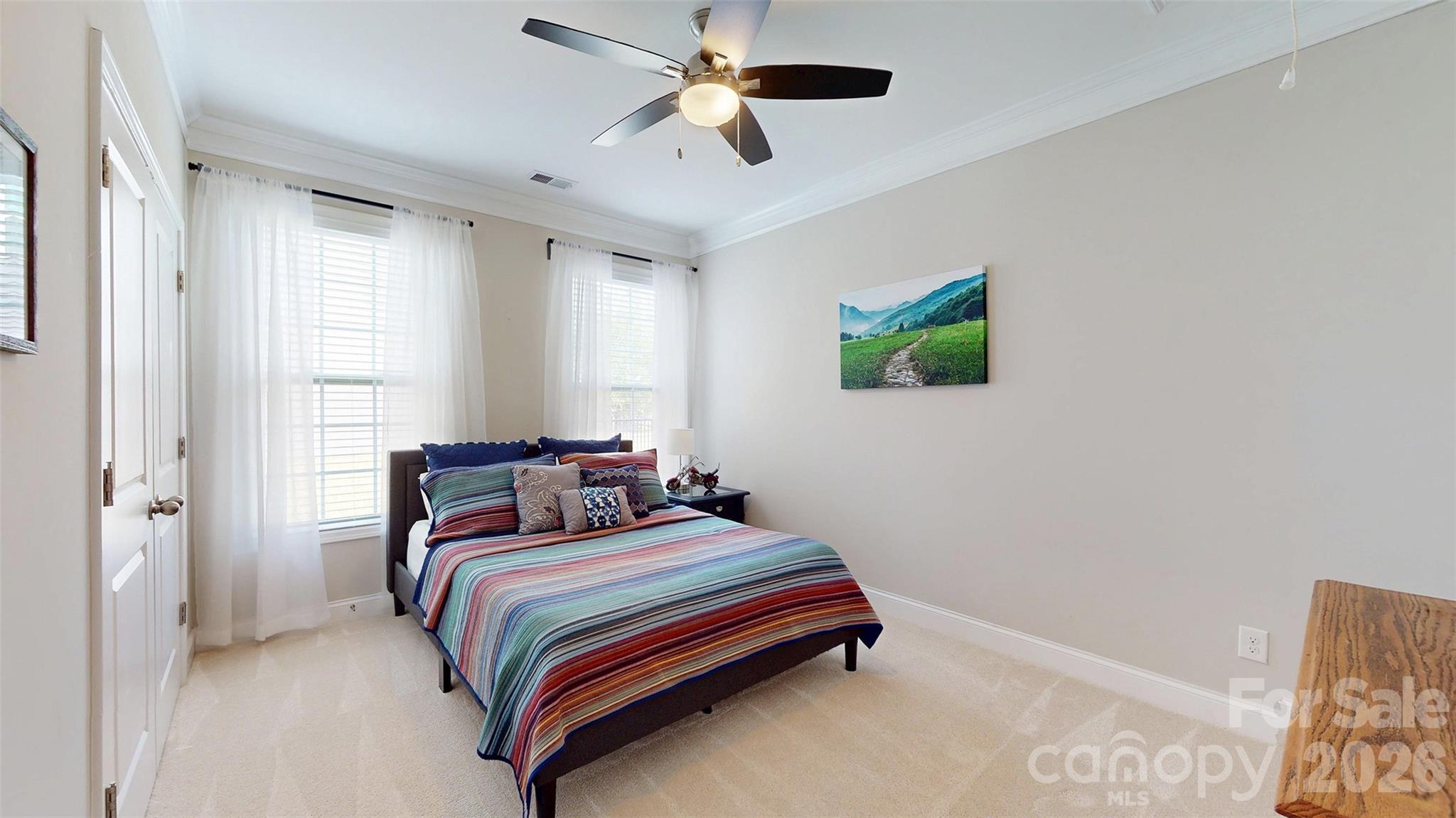 3036 Bridgewater Street Lancaster, SC 29720 - Photo 23 of 41 a bedroom with a bed and a chandelier