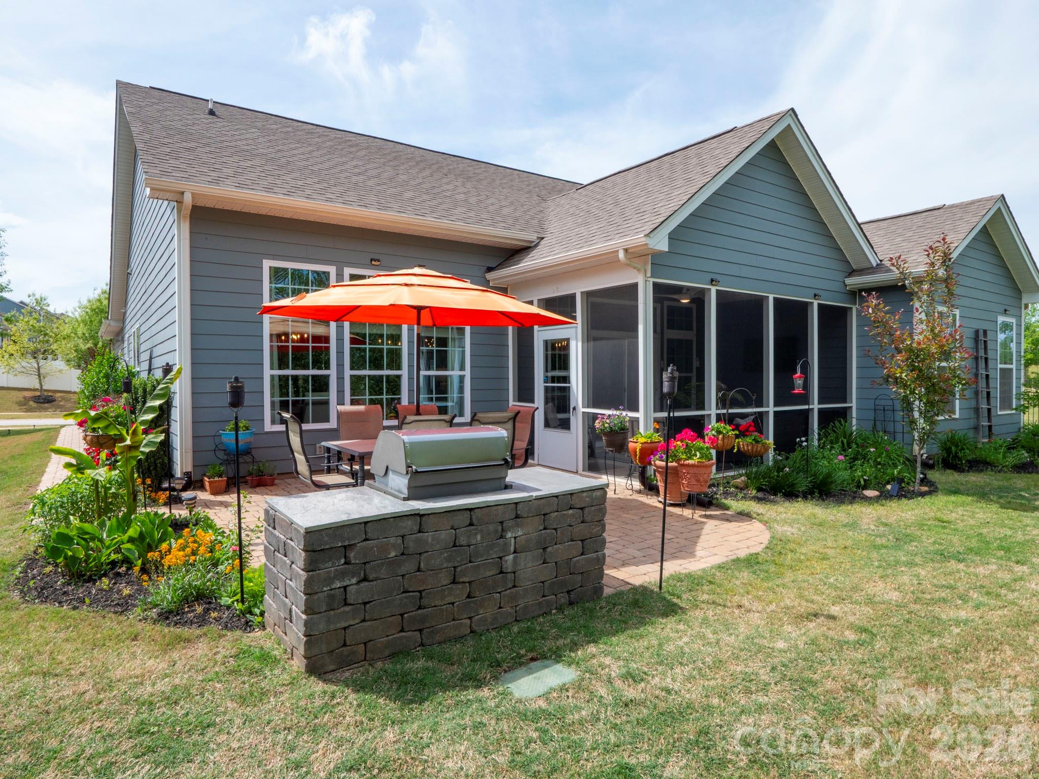 3036 Bridgewater Street Lancaster, SC 29720 - Photo 29 of 41 a view of a dinning tables and chairs in the patio