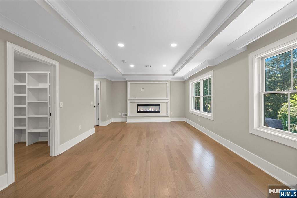 326 Northern Parkway Ridgewood, NJ 07450 - Photo 11 of 47 a view of an empty room with a window and wooden floor