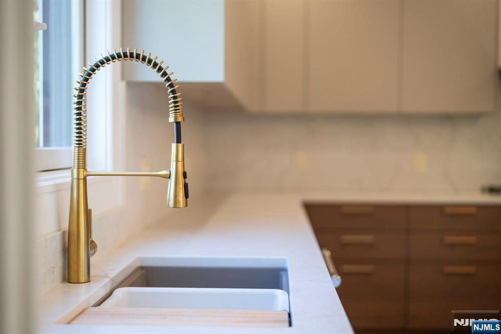 326 Northern Parkway Ridgewood, NJ 07450 - Photo 13 of 30 a view of staircase with white walls and railing