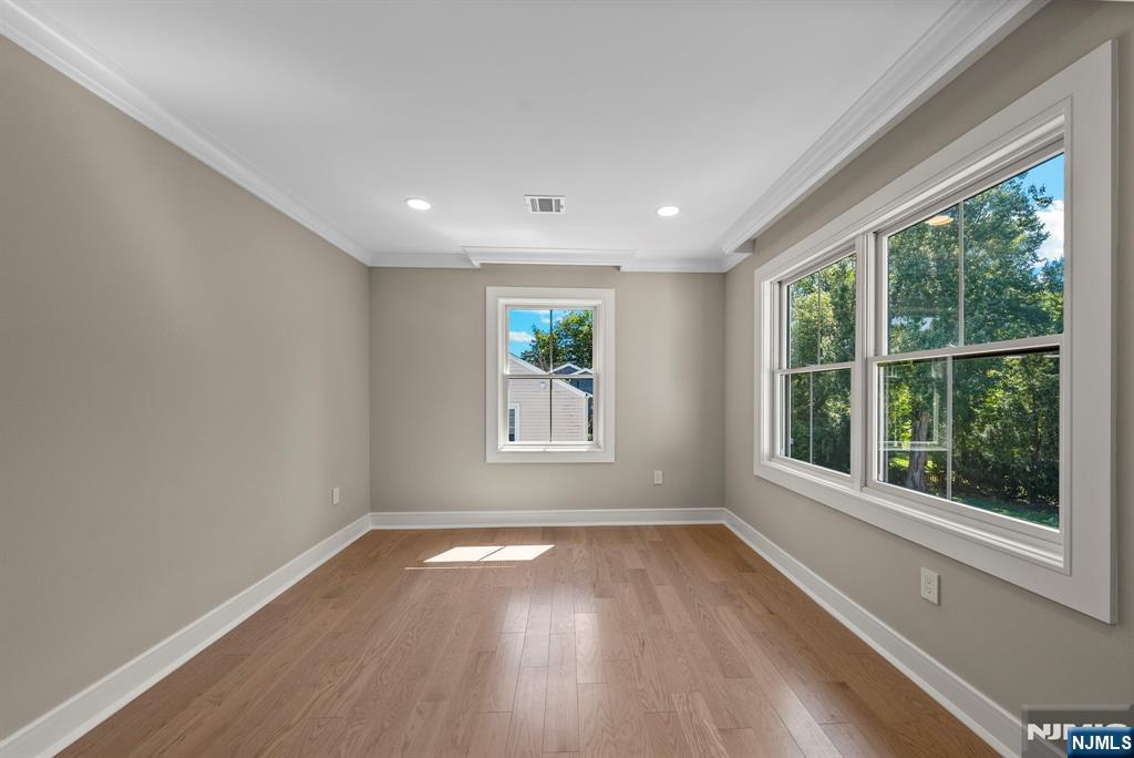 326 Northern Parkway Ridgewood, NJ 07450 - Photo 14 of 47 a view of empty room with wooden floor and fan