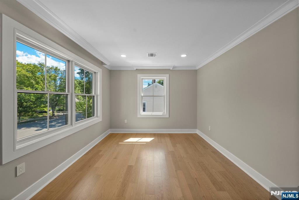 326 Northern Parkway Ridgewood, NJ 07450 - Photo 16 of 47 a view of empty room with wooden floor and fan