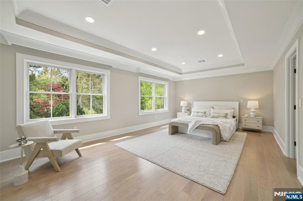 326 Northern Parkway Ridgewood, NJ 07450 - Photo 17 of 30 a spacious bedroom with a bed and a large window