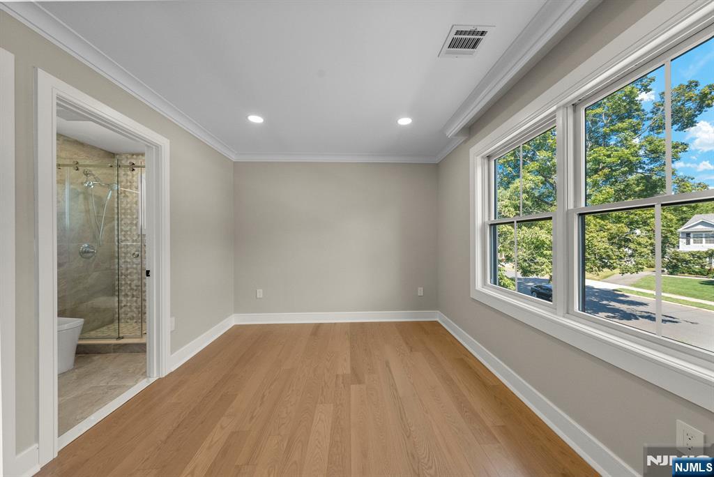326 Northern Parkway Ridgewood, NJ 07450 - Photo 18 of 47 a view of a room with wooden floor and a window