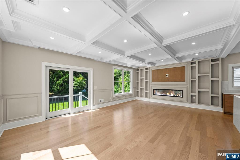 326 Northern Parkway Ridgewood, NJ 07450 - Photo 21 of 47 a big room with wooden floor garden view and windows