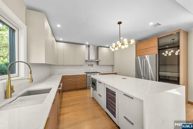 a kitchen with a sink stove and refrigerator