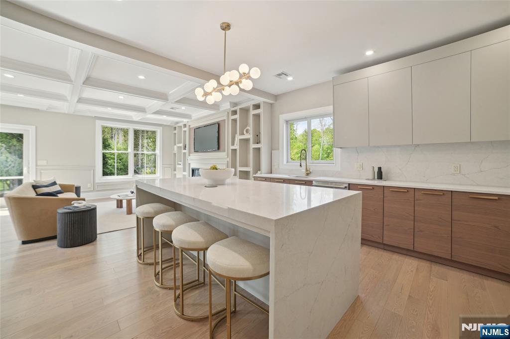326 Northern Parkway Ridgewood, NJ 07450 - Photo 25 of 30 a large kitchen with kitchen island white cabinets and refrigerator