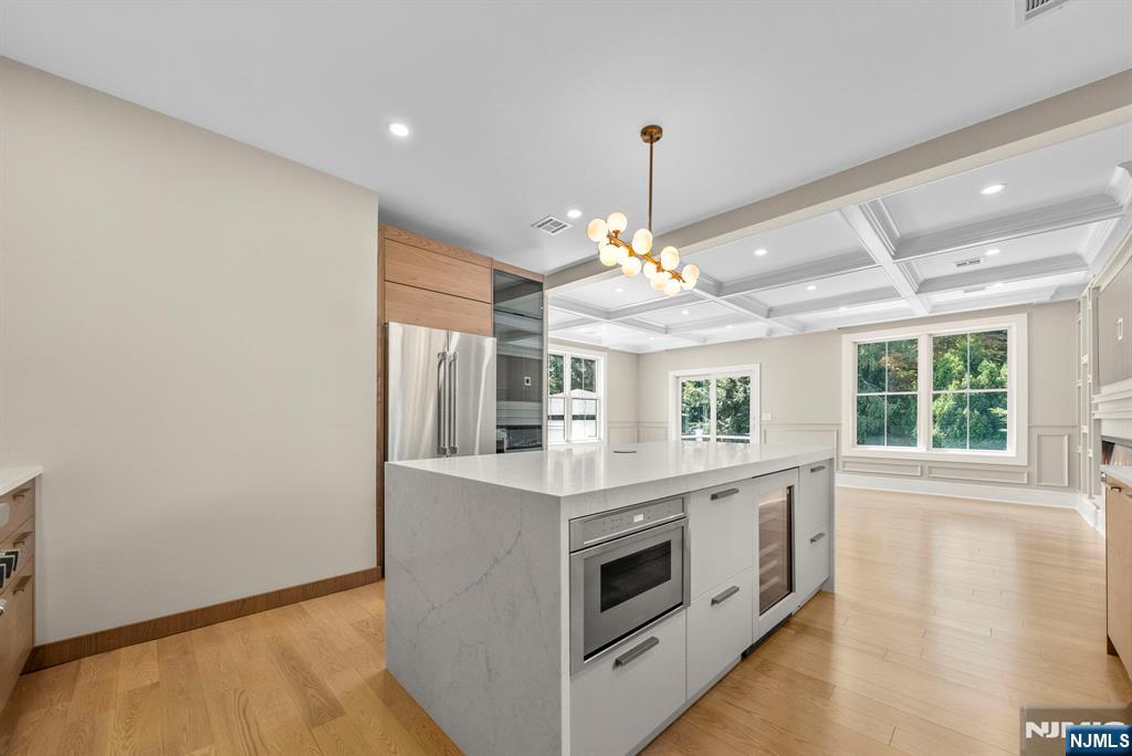 326 Northern Parkway Ridgewood, NJ 07450 - Photo 26 of 47 a kitchen with a stove and a chandelier