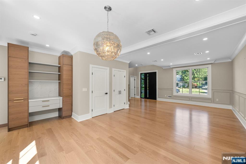 326 Northern Parkway Ridgewood, NJ 07450 - Photo 30 of 47 a view of an empty room with a window and wooden floor