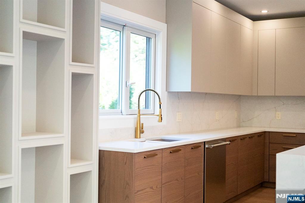 326 Northern Parkway Ridgewood, NJ 07450 - Photo 38 of 47 a kitchen with a sink and cabinets