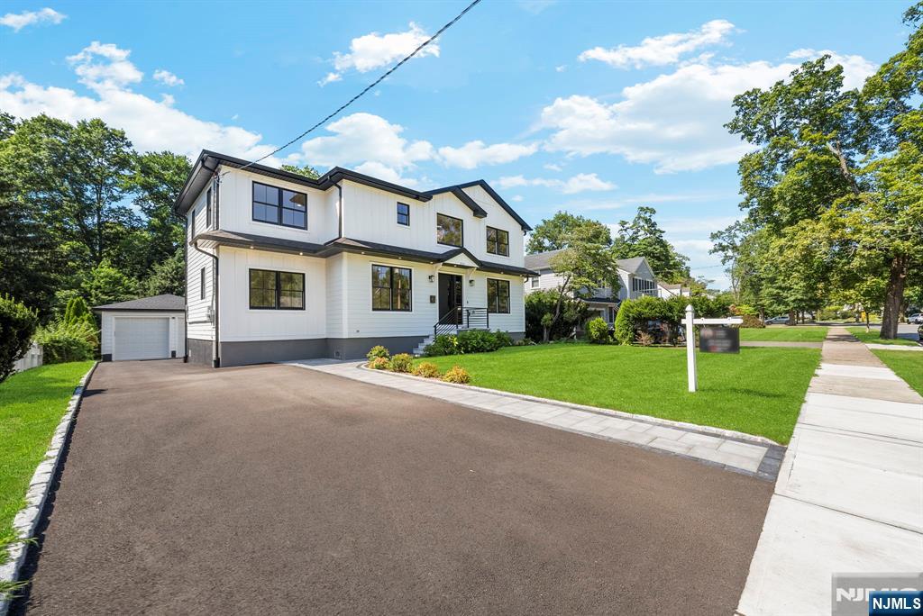 326 Northern Parkway Ridgewood, NJ 07450 - Photo 4 of 47 a view of a house with a big yard and large trees