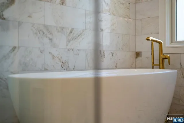 a view of a bathtub in a bathroom