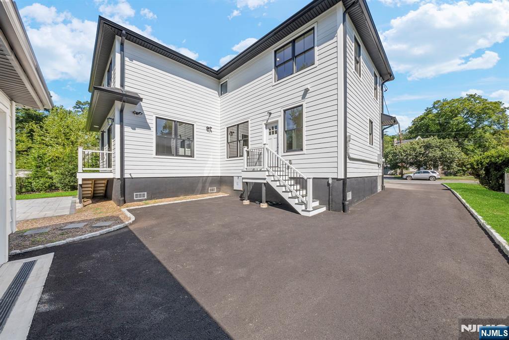 326 Northern Parkway Ridgewood, NJ 07450 - Photo 45 of 47 a view of a house with backyard and a yard