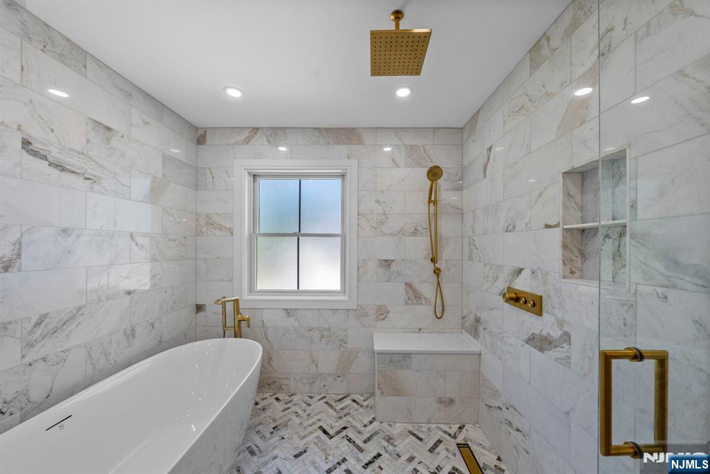 326 Northern Parkway Ridgewood, NJ 07450 - Photo 7 of 30 a bathroom with a tub and a shower