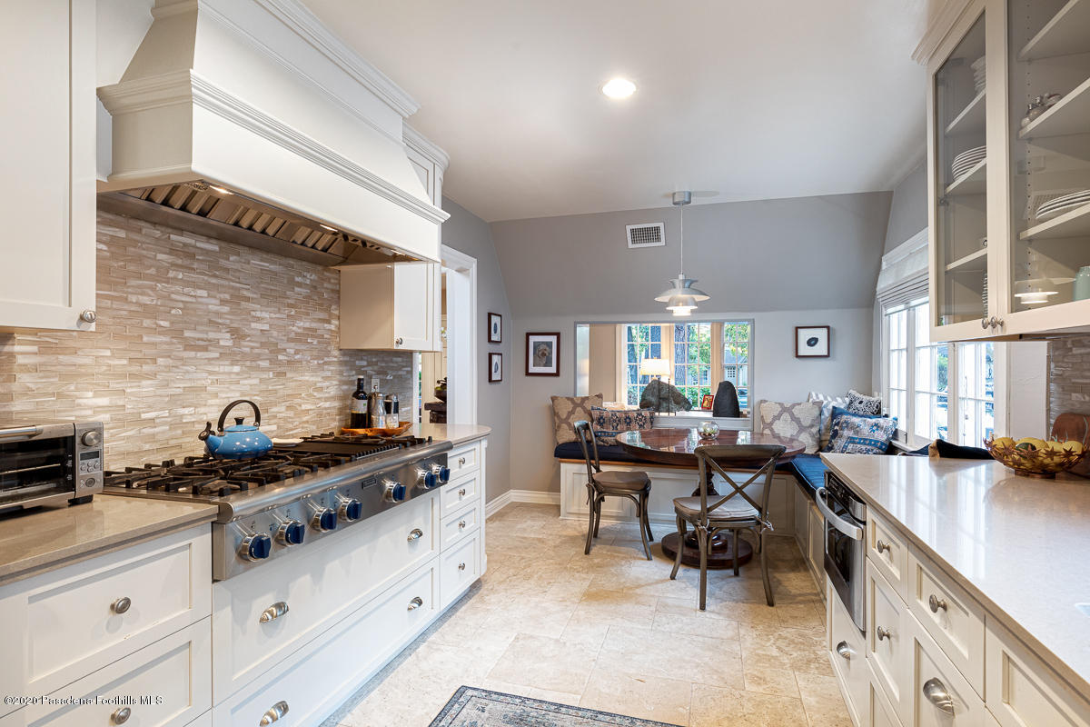 72 Annandale Road Pasadena, CA 91105 - Photo 16 of 45 a kitchen with lots of counter top space and dining table