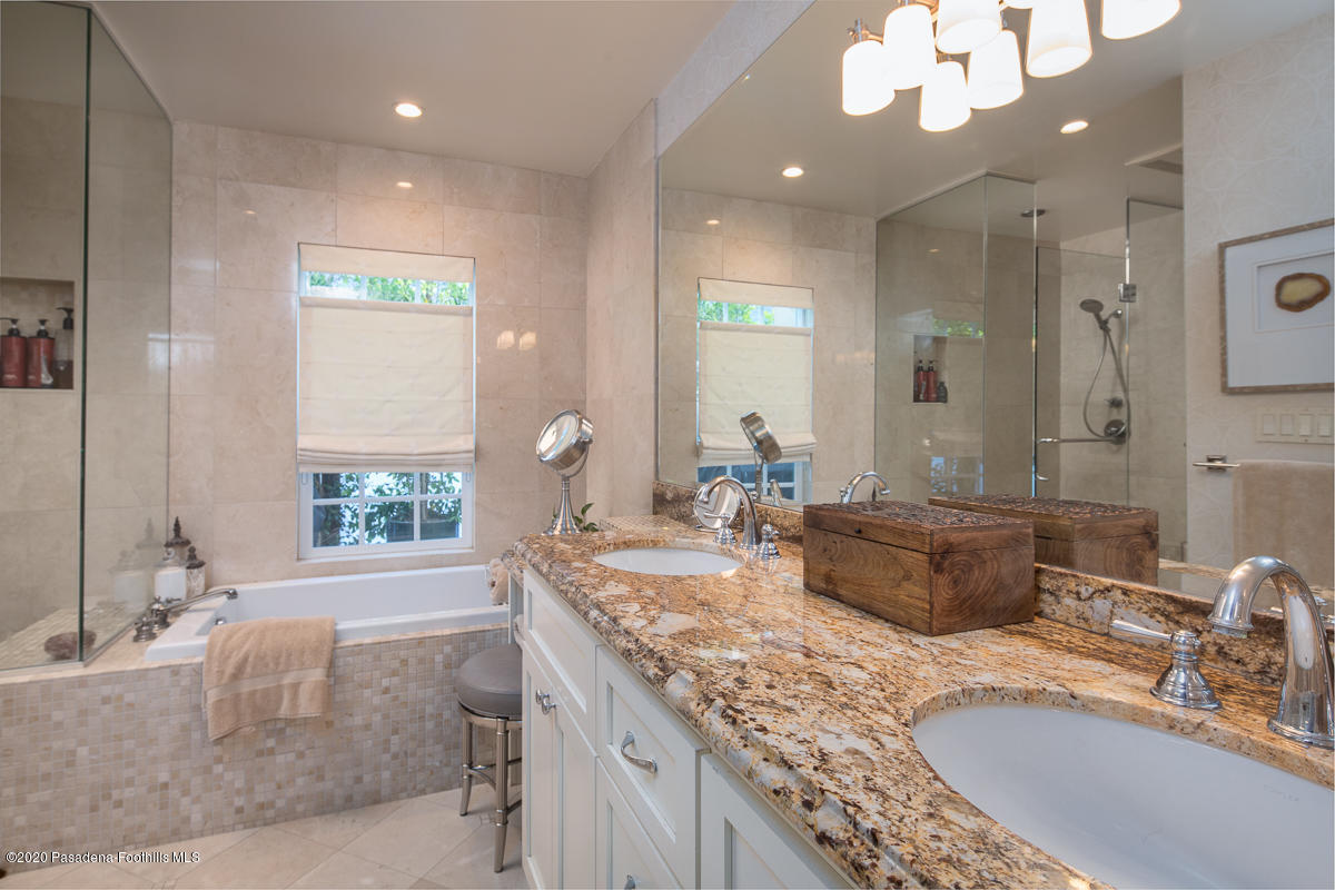 72 Annandale Road Pasadena, CA 91105 - Photo 23 of 45 a bathroom with a granite countertop sink a mirror and a bathtub