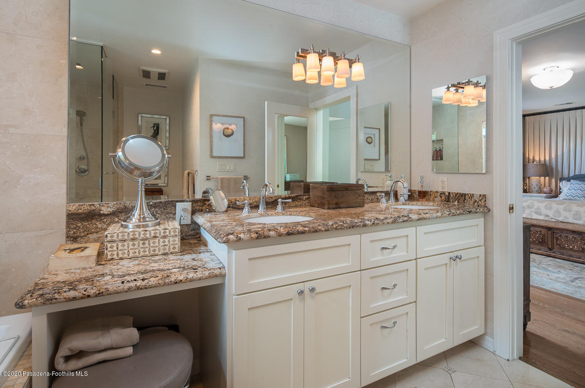 72 Annandale Road Pasadena, CA 91105 - Photo 25 of 45 a bathroom with a granite countertop sink a toilet and a mirror
