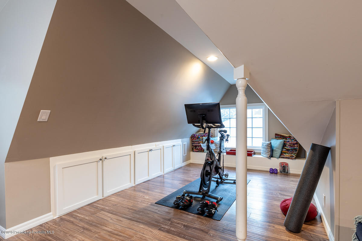 72 Annandale Road Pasadena, CA 91105 - Photo 34 of 45 a view of a room with wooden floor and gym equipment