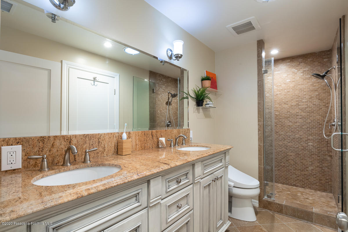 72 Annandale Road Pasadena, CA 91105 - Photo 38 of 45 a bathroom with a granite countertop sink a toilet a mirror and shower