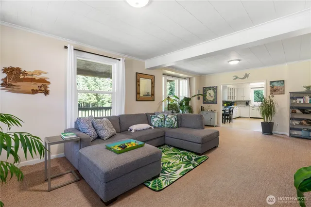 a utility room with cabinets washer and dryer