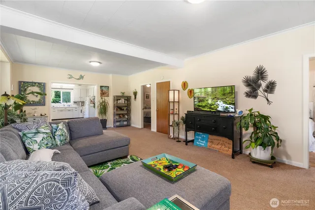 a bedroom with bed and a potted plant