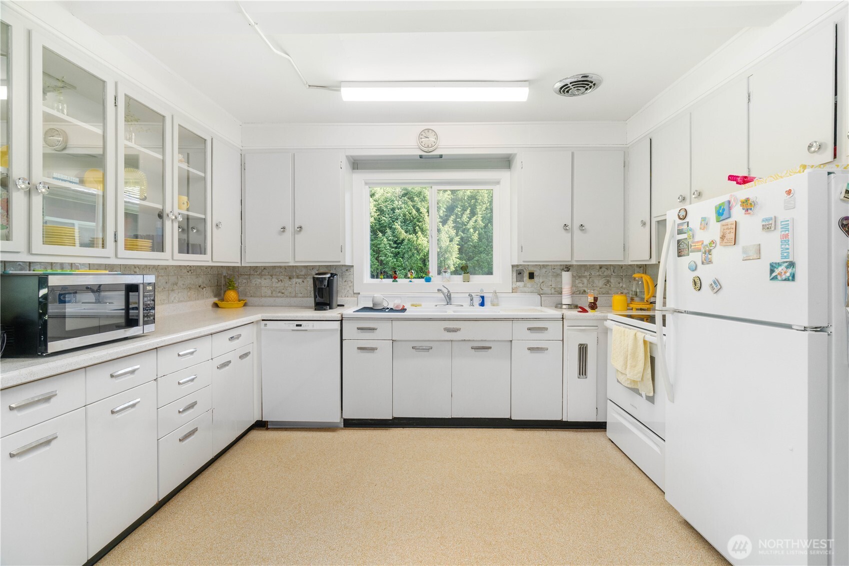 Undisclosed Address Forks, WA 98331 - Photo 16 of 39 a kitchen with white cabinets and white appliances