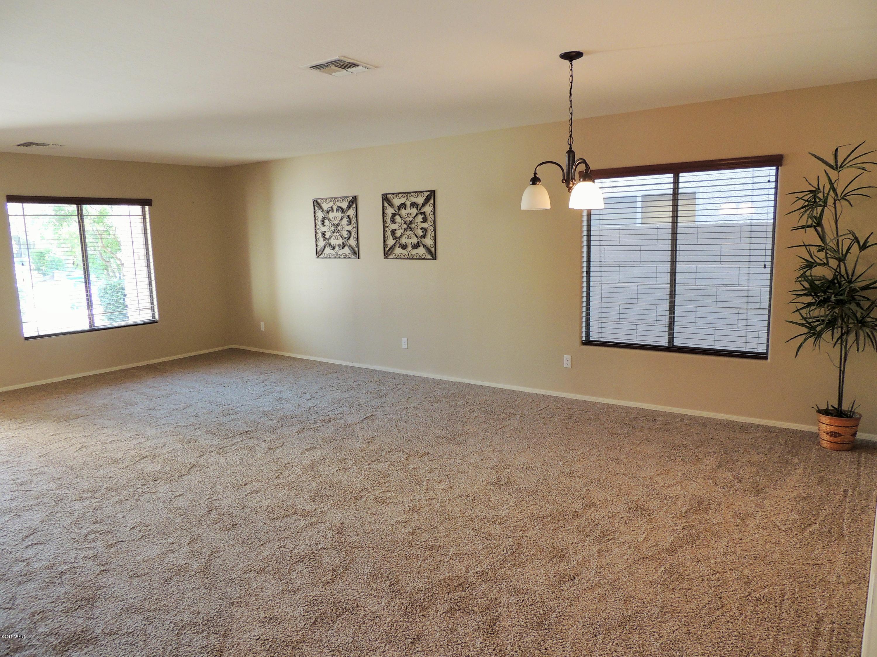 43266 West Magnolia Road Maricopa, AZ 85138 - Photo 3 of 34 Living Room 2