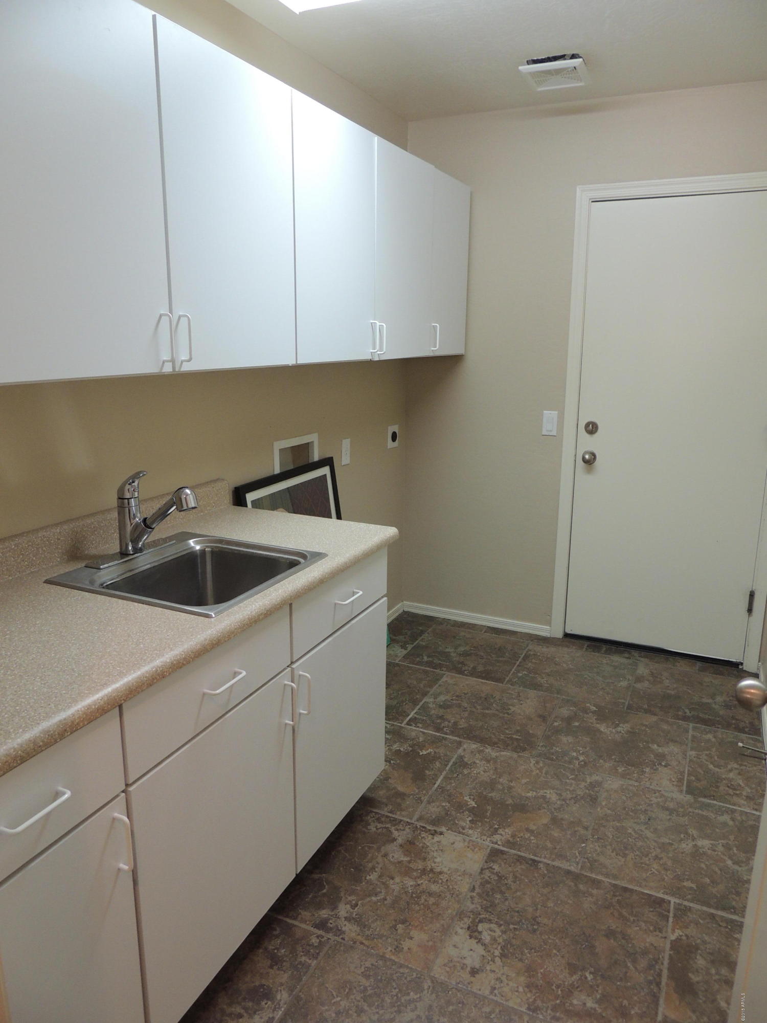 43266 West Magnolia Road Maricopa, AZ 85138 - Photo 33 of 34 Laundry w/Sink and Cabinets