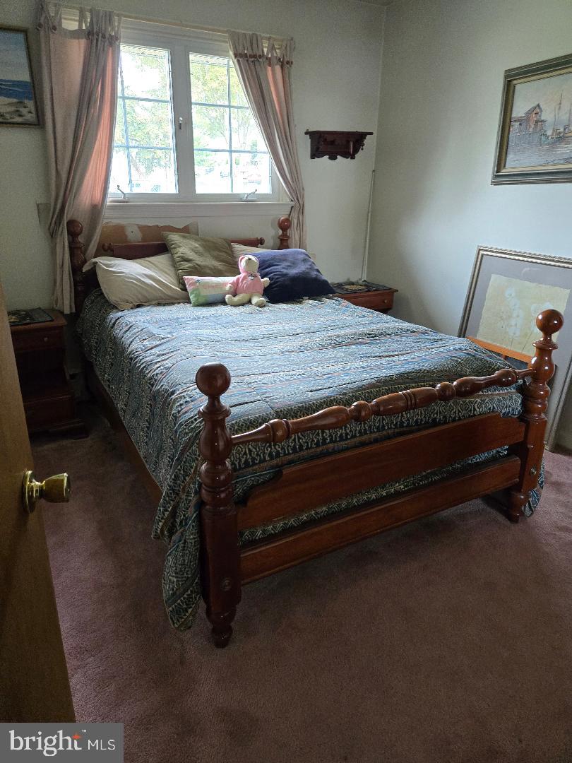16 Lawnton Road Willow Grove, PA 19090 - Photo 4 of 9 a bedroom with a bed and window