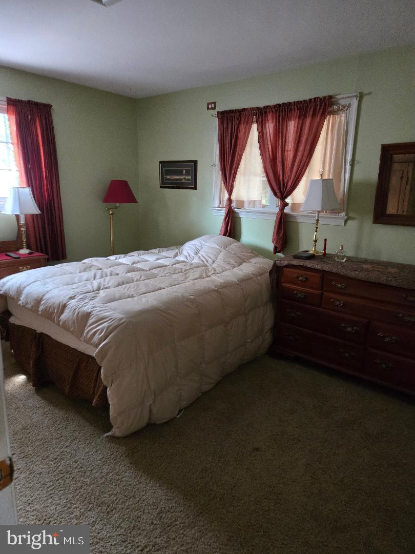 16 Lawnton Road Willow Grove, PA 19090 - Photo 5 of 9 a bedroom with a bed dresser and window